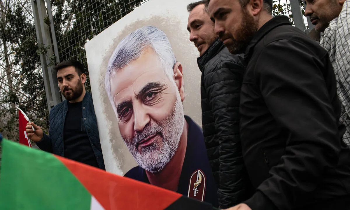 People hold posters showing the portrait of Iranian Revolutionary Guard Maj. Gen. Qassem Soleimani during a protest outside the U.S. Consulate in Istanbul, Turkey, on Jan. 5, 2020. (Chris McGrath/Getty Images)