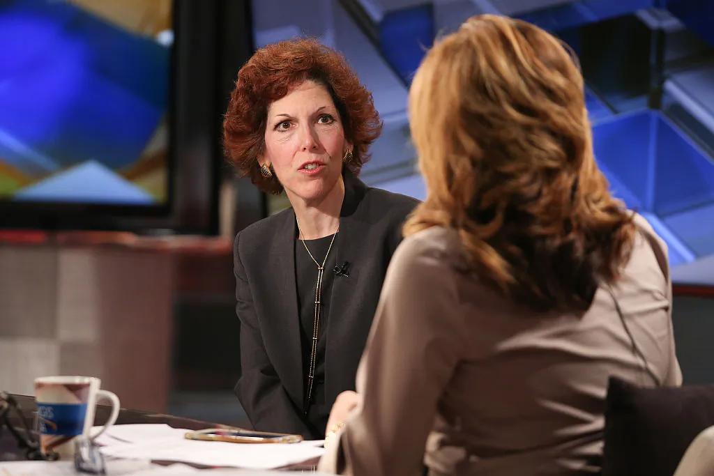 Cleveland Federal Reserve President Loretta Mester (L) talks with a reporter in New York on April 1, 2016. (Rob Kim/Getty Images)