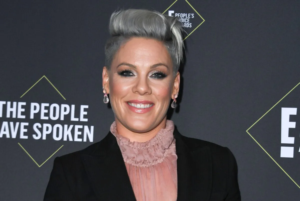 US singer/songwriter Pink poses with the Peoples Champion Award during the 45th annual E! People's Choice Awards at Barker Hangar in Santa Monica, California, on Nov. 10, 2019. (VALERIE MACON/AFP via Getty Images)