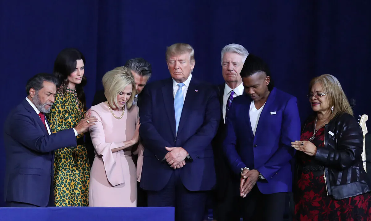 Faith leaders pray over President Donald Trump during a 'Evangelicals for Trump' campaign event held at the King Jesus International Ministry in Miami, Fla., on Jan. 3, 2020. (Joe Raedle/Getty Images)