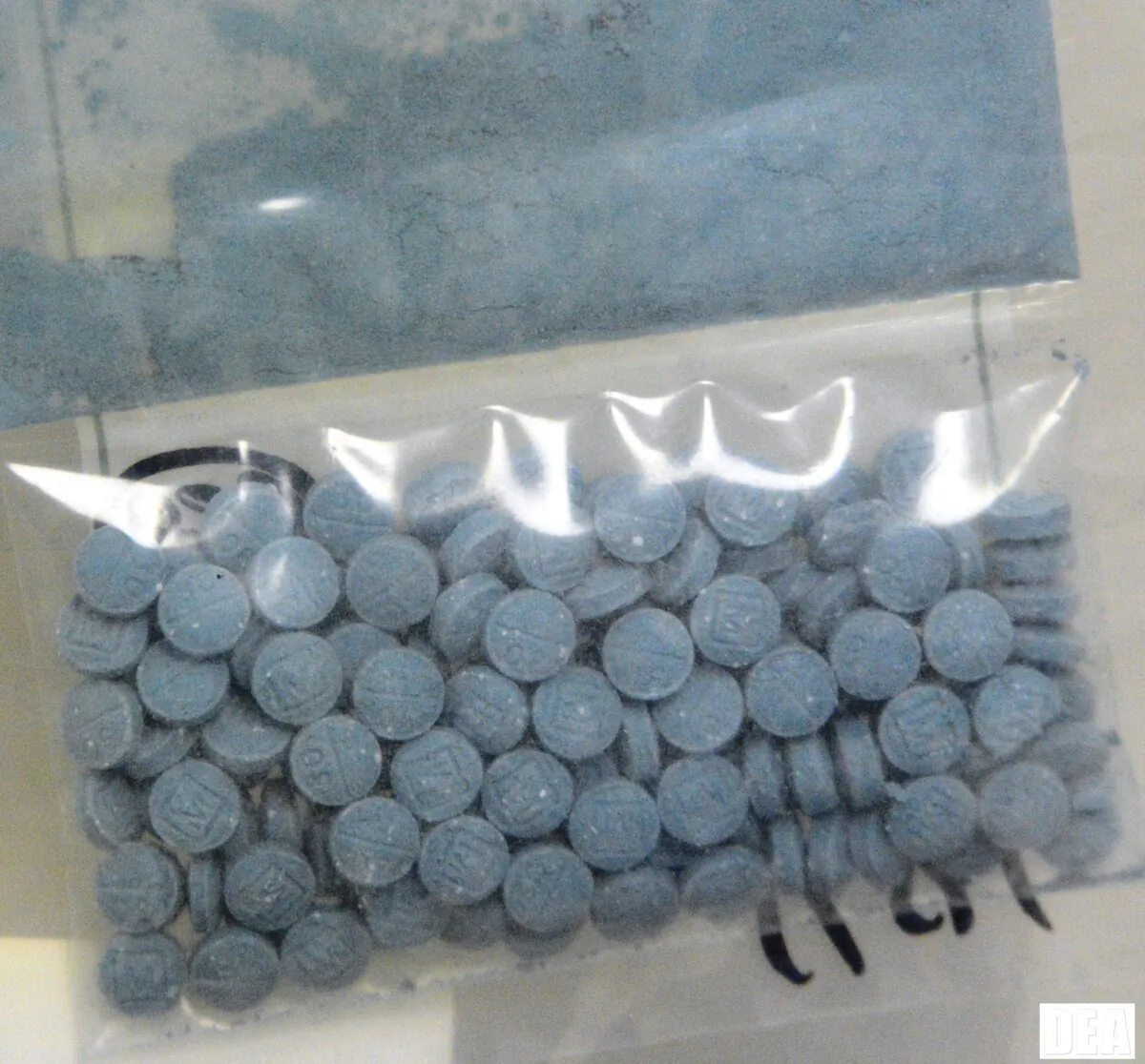 Heroin and fentanyl pressed into pill form. (DEA)