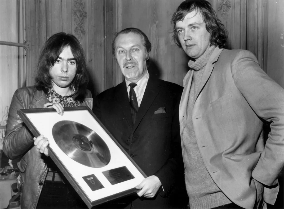 British composer Andrew Lloyd Webber (L) and lyricist Tim Rice (R) are presented with the Gold and Platinum discs for their hit musical “Jesus Christ Superstar” in December 1971. Jesus has been appropriated by the adherents of practically every progressive movement—socialism, pacifism, liberation theology, feminism, free love, flower power, Black Power, Occupy Wall Street—of the past two centuries. (Evening Standard/Getty Images)