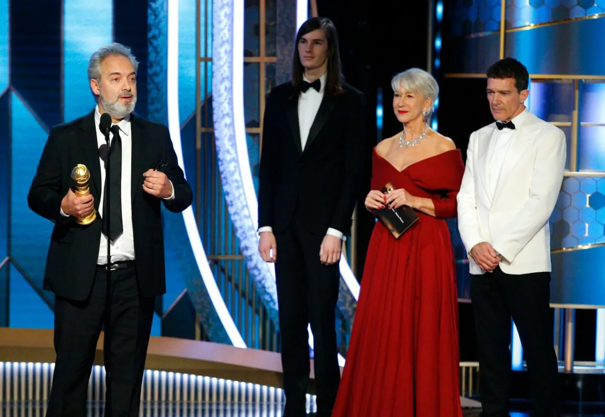 Filmmaker Sam Mendes (L) accepts the award for Best Director - Motion Picture for "1917," at the 77th Golden Globe Awards Show in Beverly Hills, Calif., on Jan. 5, 2020. (Paul Drinkwater/NBC Universal/Handout via Reuters)