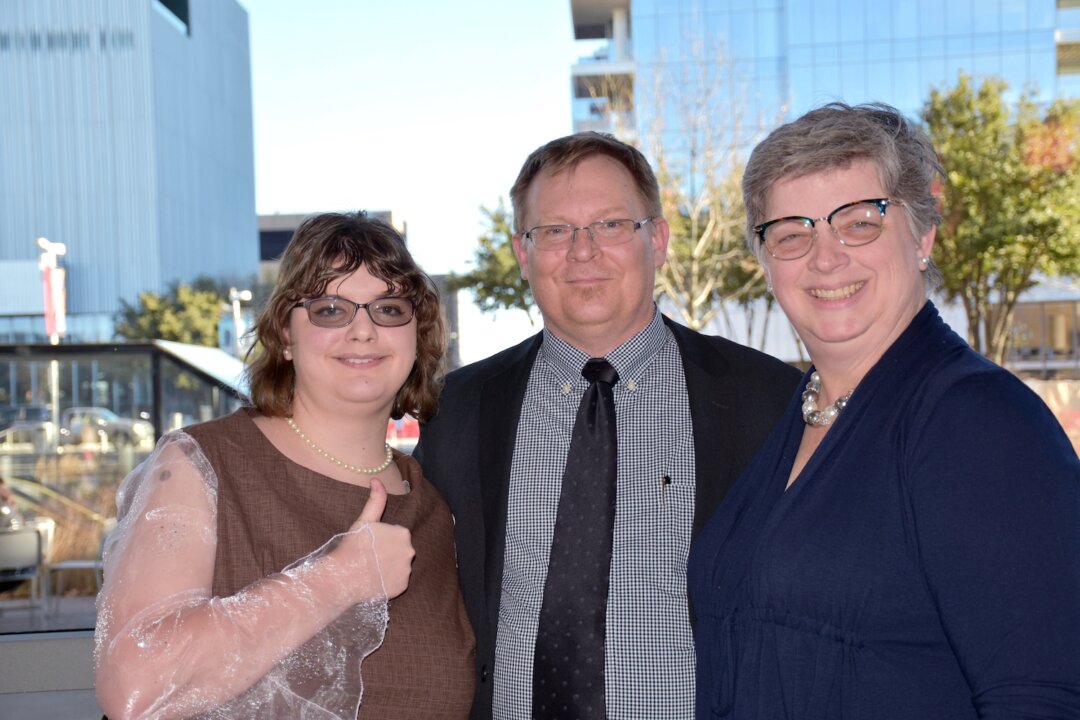 Christina Null (R), with her husband Michael Null (C) and her daughter, Elizabeth Meyers (L). Christina is a professional cellist who attended Shen Yun Performing Arts at the AT&T Performing Arts Center, Jan. 5, 2020. (Amy Hu/The Epoch Times)