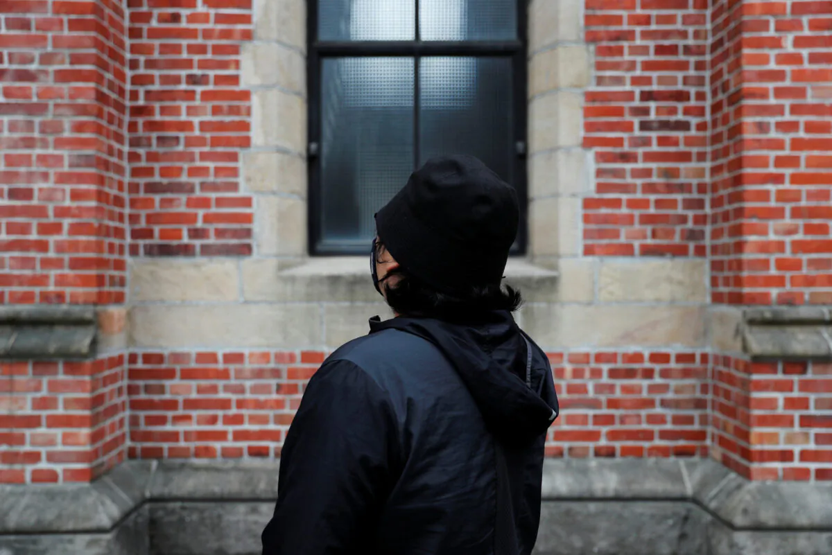 A protester in his early 30s, who asked only to be identified as Jero, poses for photo at a Presbyterian Church in Taipei, Taiwan on Dec. 23, 2019. (Tyrone Siu/Reuters)