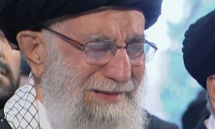 Iranian Supreme Leader Ayatollah Ali Khamenei openly weeps as he leads a prayer over the coffin of Gen. Qassem Soleimani at the Tehran University campus, in Tehran, Iran, on Jan. 6, 2020. (Iran Press TV via AP)