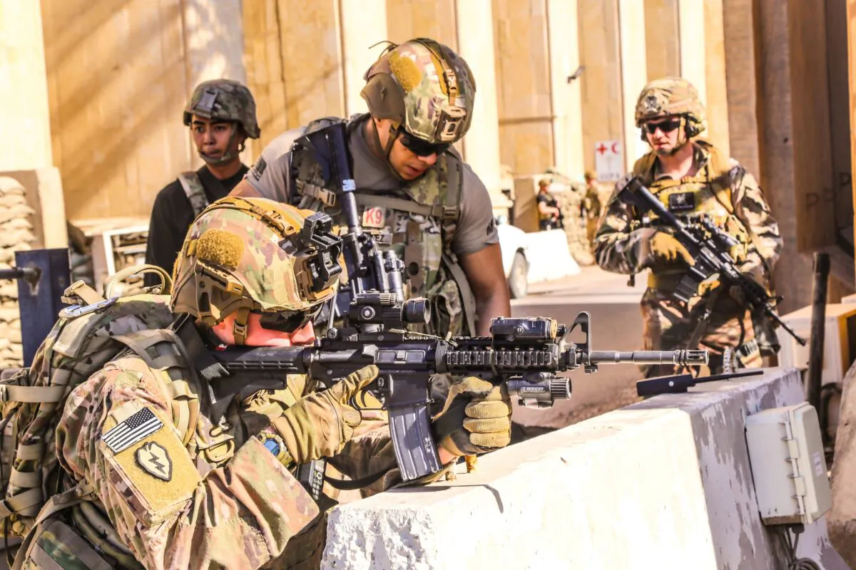 U.S. Army soldiers from 1st Brigade, 25th Infantry Division, Task Force-Iraq, man a defensive position at Forward Operating Base Union III in Baghdad, Iraq, on Dec. 31, 2019. (U.S. Army/Staff Sgt. Desmond Cassell/Task Force-Iraq Public Affairs/Handout via Reuters)