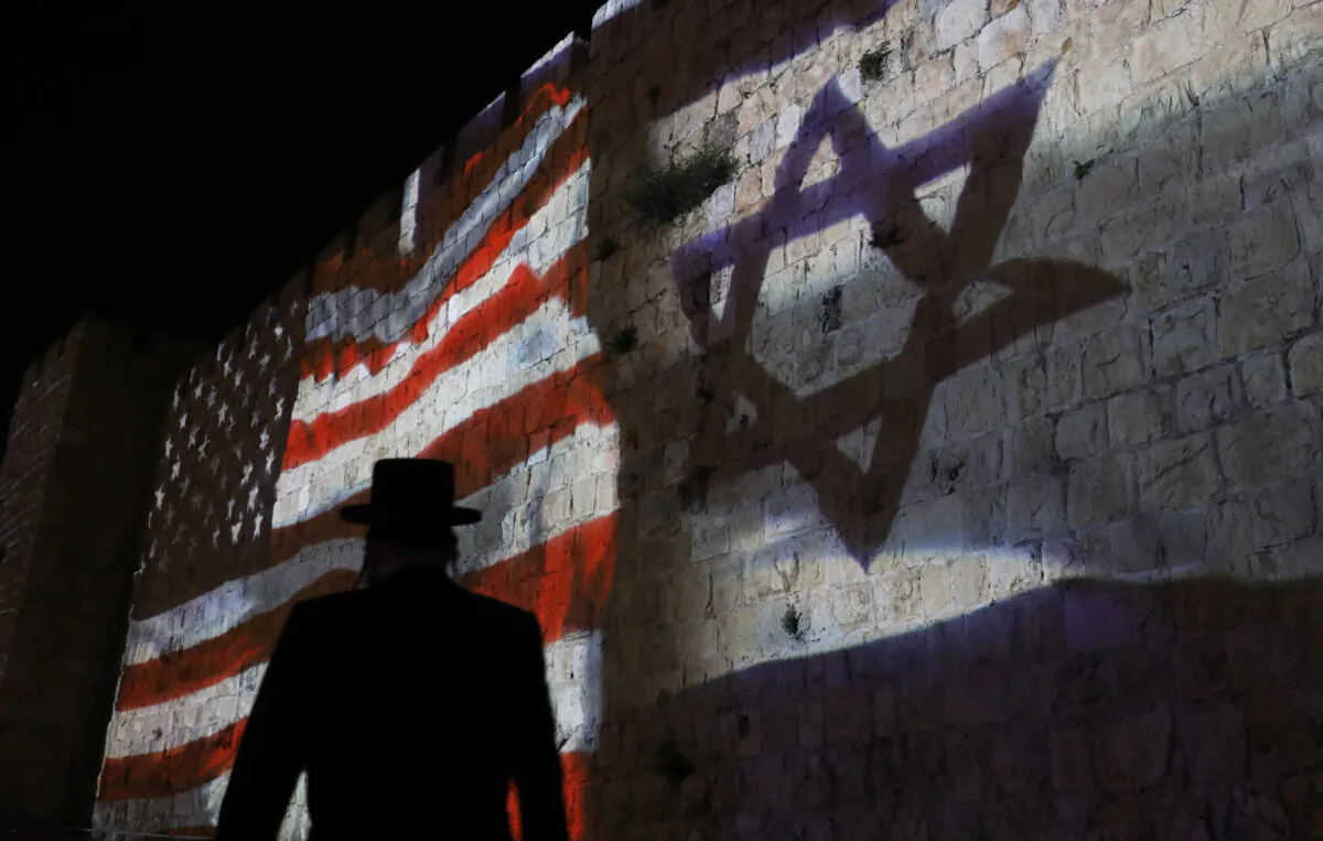 The Israeli and United States flags are projected on the walls of the ramparts of Jerusalem's Old City, to mark one year since the transfer of the US Embassy from Tel Aviv to Jerusalem on May 15, 2019. (Ahmad Gharabli/AFP via Getty Images)
