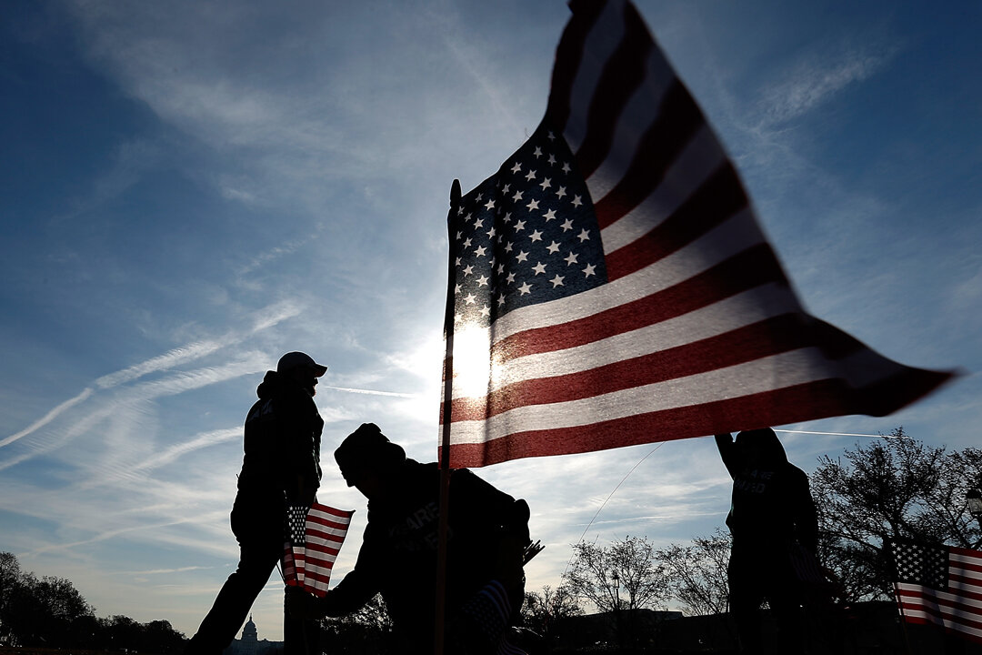 U.S. military veterans set up 1,892 American flags on the National Mall in Washington on March 27, 2014. (Win McNamee/Getty Images)