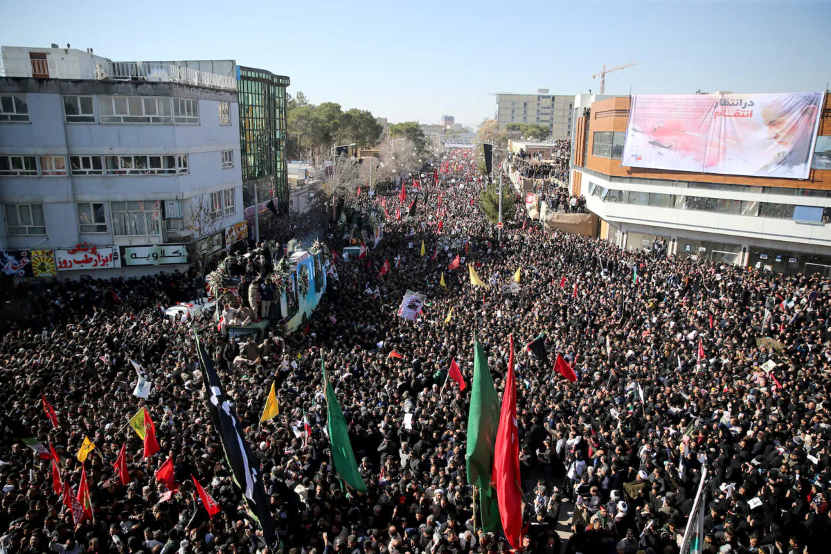 Iranian people attend a funeral procession and burial for Iranian Major-General Qassem Soleimani, head of the elite Quds Force, who was killed in an air strike at Baghdad airport, at his hometown in Kerman, Iran on Jan. 7, 2020. (Mehdi Bolourian/Fars News Agency/WANA/West Asia News Agency via Reuters)