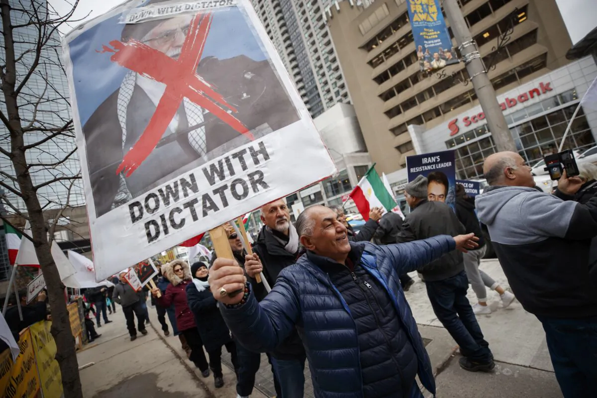 Iranian-Canadians gather in Toronto on Jan. 3, 2020, to celebrate the death of Gen. Qasem Soleimani in Iraq on Jan. 2. The killing has sparked renewed calls to designate the Islamic Revolutionary Guard Corps as a terrorist organization. (The Canadian Press/Cole Burston)