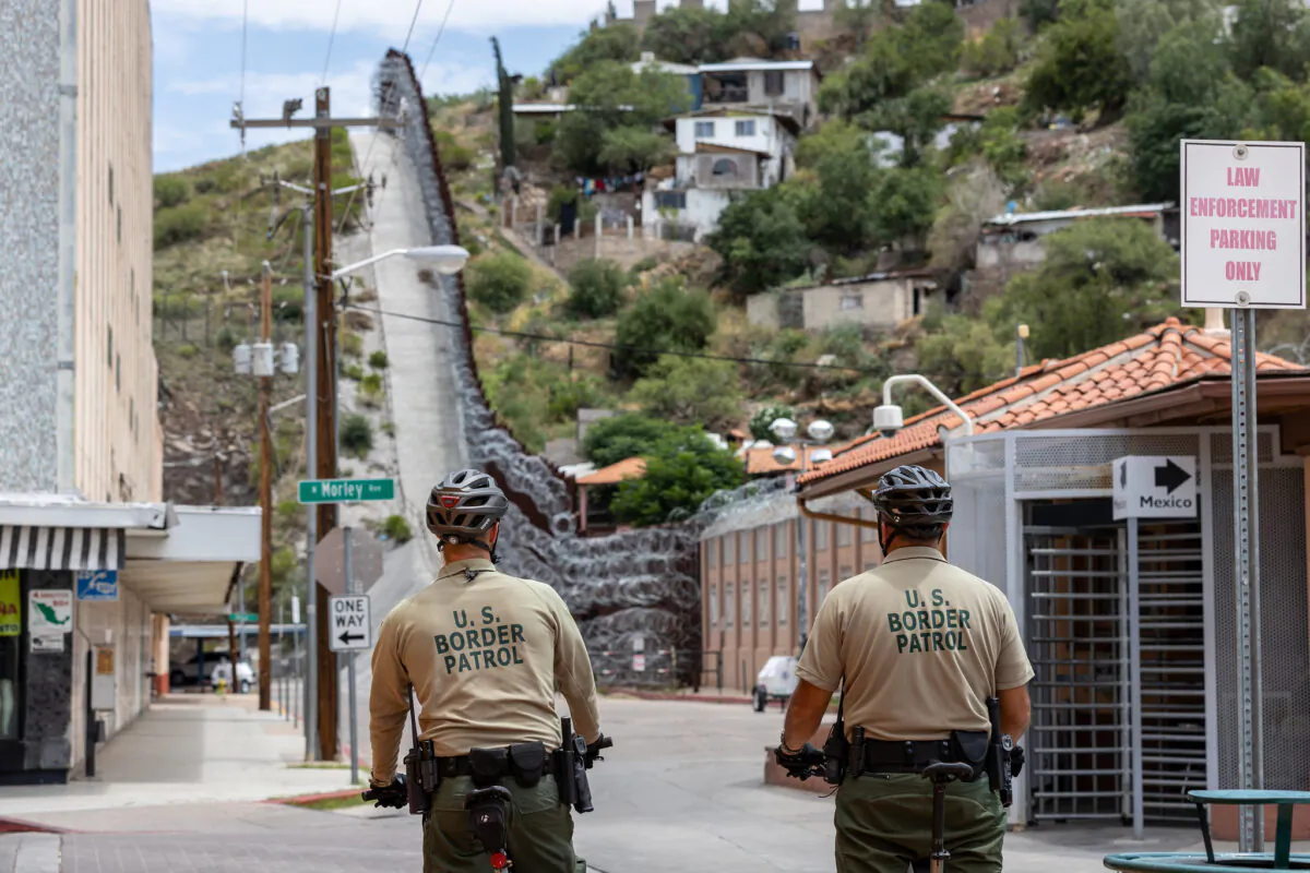 Border Patrol agents patrol the border in Nogales, Ariz., on July 29, 2019. The city of Nogales, Mexico, abuts the border fence to the right. (CBP)