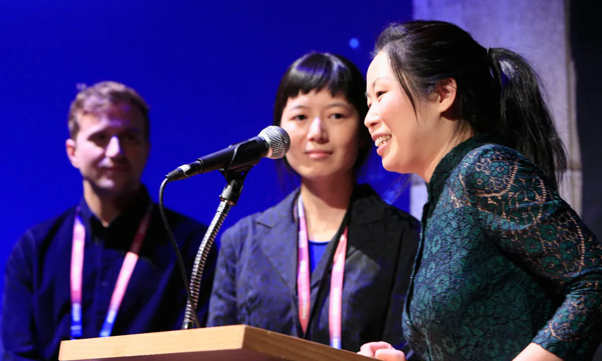 (L-R) Mike Shade, Jialing Zhang, and Nanfu Wang speak at the "One Child Nation" Premiere during the 2019 Sundance Film Festival at Egyptian Theatre in Park City, Utah, on Jan. 26, 2019. (Chad Hurst/Getty Images)