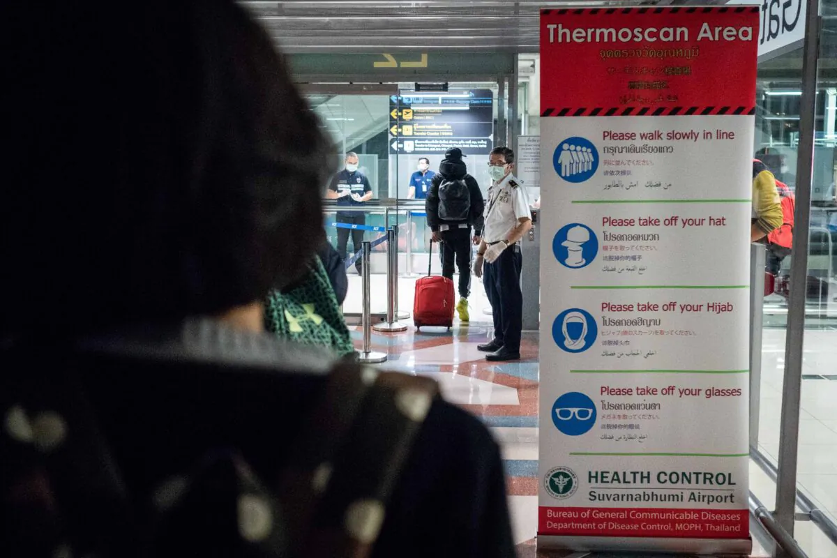 Thailand Public Health Officials run thermal scans on passengers arriving from Wuhan, China at Suvarnabumi Airport in Bangkok, Thailand on Jan. 8, 2020. (Lauren DeCicca/Getty Images)