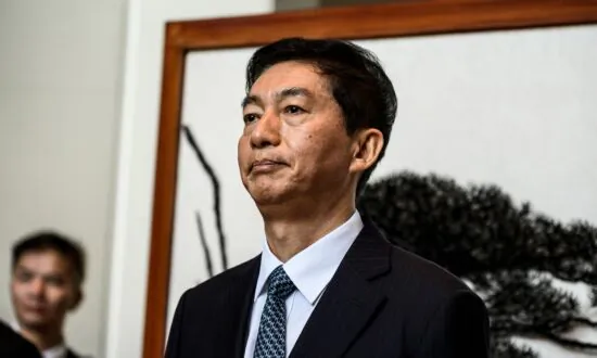 New Chinese Official in Charge of Hong Kong Affairs Seeks to Further Integrate City with Mainland: Analysts