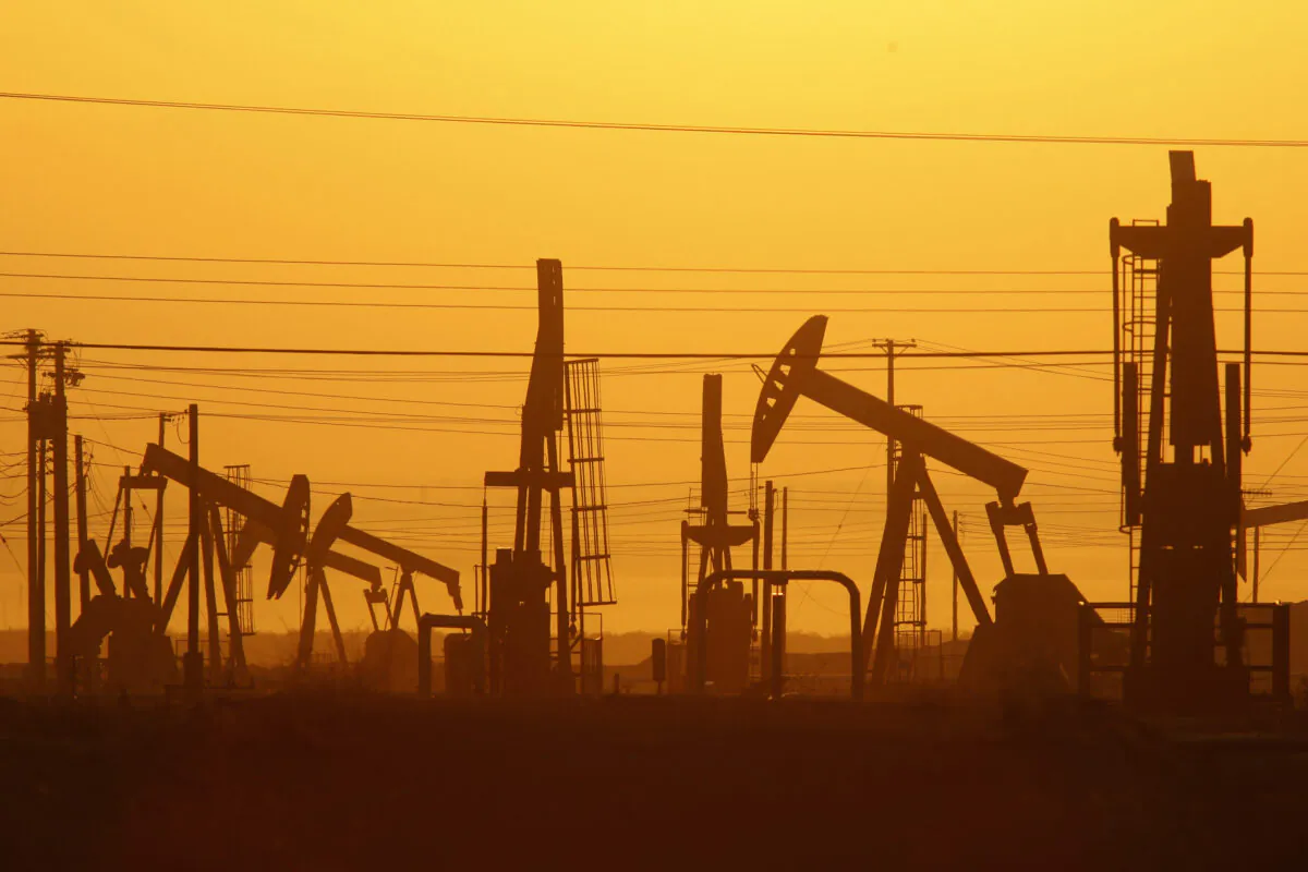 Pump jacks are seen at dawn in an oil field over the Monterey Shale formation near Lost Hills, Calif., on March 24, 2014.  David McNew/Getty Images