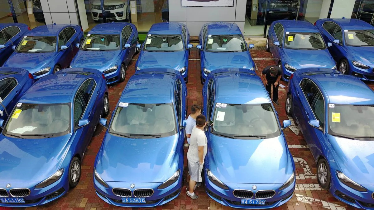 People look at a BMW 1-Series "car-sharing" in Shenyang in China's northeastern Liaoning Province on Aug. 10, 2017. (STR/AFP via Getty Images)