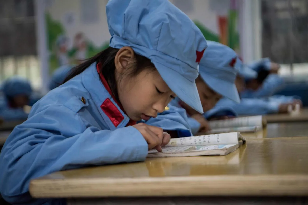 Students working in their class at the Yang Dezhi "Red Army" elementary school in Wenshui, Xishui county in Guizhou province, on Nov. 7, 2016. (Fred Dufour/AFP via Getty Images)