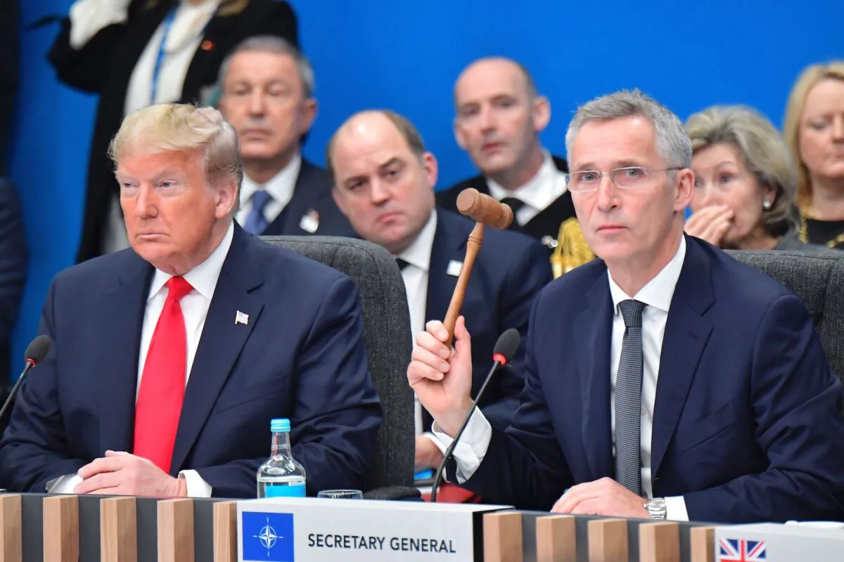 President Donald Trump (L) and NATO Secretary General Jens Stoltenberg attend the plenary session of the NATO summit at the Grove hotel in Watford, northeast of London, on Dec. 4, 2019. (Tobias Schwarz/AFP via Getty Images)