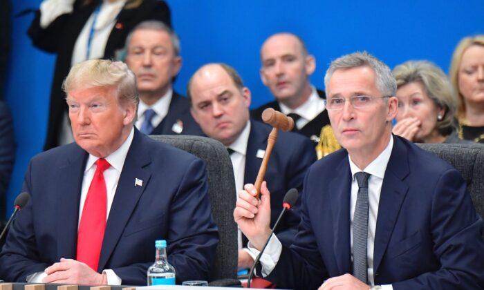 President Donald Trump (L) and NATO Secretary General Jens Stoltenberg attend the plenary session of the NATO summit at the Grove hotel in Watford, northeast of London, on Dec. 4, 2019. (Tobias Schwarz/AFP via Getty Images)