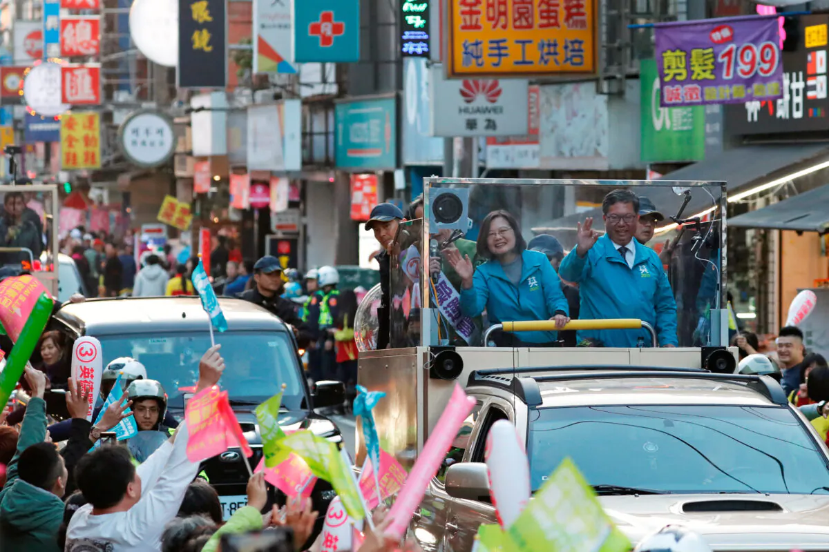 Taiwan President Tsai Ing-wen waves to supporters from a vehicle during a campaign rally ahead of the election in Taoyuan, Taiwan on Jan. 9, 2020. (Tyrone Siu/Reuters)