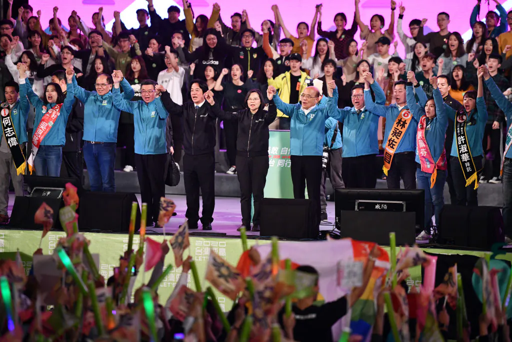 Taiwan's current president and Democratic Progressive Party presidential candidate, Tsai Ing-wen (in black) stands with party colleagues on stage during a rally ahead of Saturday's presidential election in Taipei, Taiwan, on Jan. 10, 2020. (Carl Court/Getty Images)