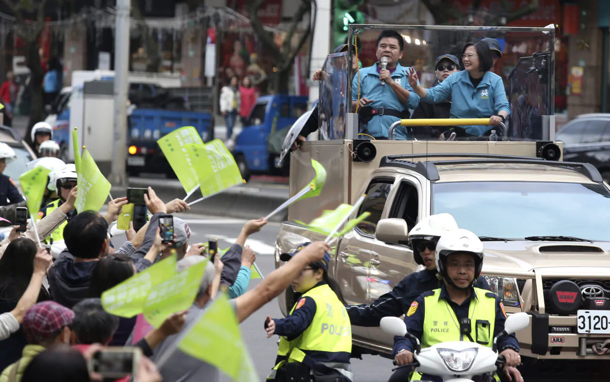 Taiwan's 2020 presidential election candidate, Taiwan president Tsai Ing-wen of the Democratic Progressive Party (DPP), waves to the crowd from an election campaign car in Taipei, Taiwan on Jan. 10, 2020. Taiwan will hold its presidential election on Jan. 11, 2020. (Chiang Ying-ying/AP)