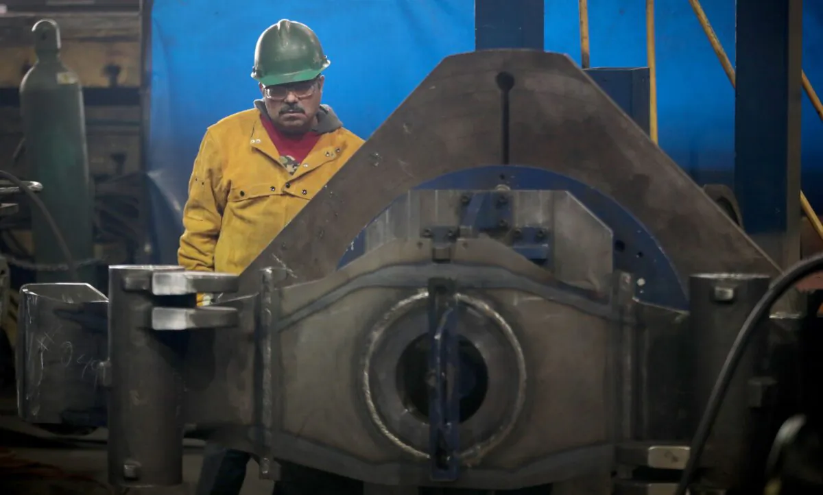 A worker at LB Steel LLC in Harvey, Ill., on Dec. 4, 2019. (Scott Olson/Getty Images)