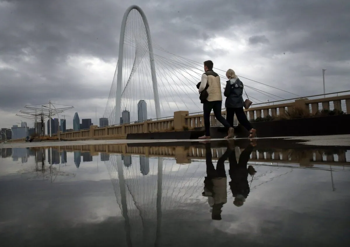 Clouds from a passing shower move across the Dallas skyline and the Margaret Hunt Hill Bridge on Jan. 10, 2020. (Tom Fox/The Dallas Morning News via AP)