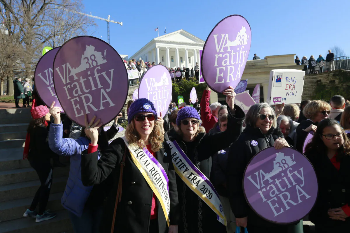 Equal Rights Amendment supporters demonstrate outside Virginia State Capitol in Richmond, Va., on Jan. 8, 2020. (AP Photo/Steve Helber)