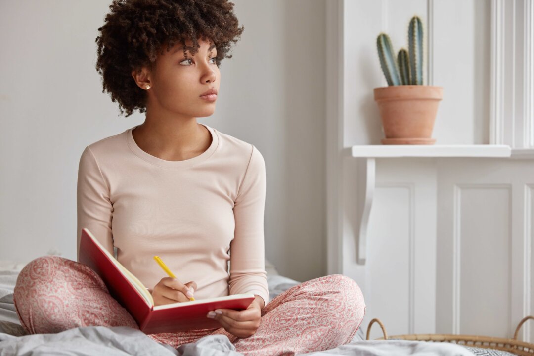 Writing out our stresses and anxieties can help our brains run more efficiently, researchers found. (WAYHOME studio/Shutterstock)