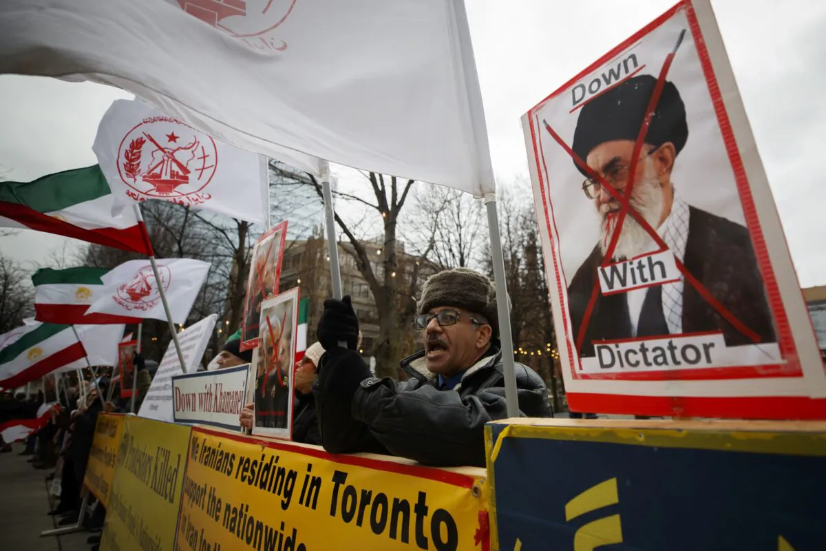 Iranian-Canadians gather in Toronto on Jan. 3, 2020, to celebrate the killing of top Iranian Gen. Qasem Soleimani by a U.S. airstrike in Iraq on Jan. 2. (The Canadian Press/Cole Burston)
