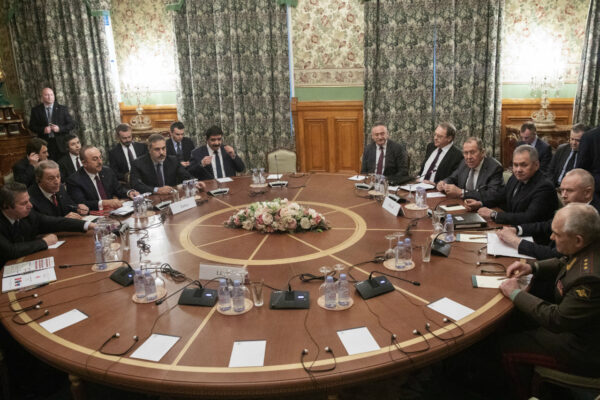 Turkish Foreign Minister Mevlut Cavusoglu, third left, Turkish Defense Minister Hulusi Akar, second left, Russian Foreign Minister Sergey Lavrov, fourth right, and Russian Defense Minister Sergei Shoigu, third right, attend the talks in Moscow, Russia, Monday, Jan. 13, 2020. (Pavel Golovkin, Pool/ AP Photo)