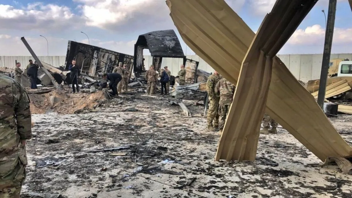 U.S. soldiers and journalists inspect the rubble at a site of Iranian bombing, in Ain al-Asad air base, Anbar, Iraq, on Jan. 13, 2020. (Qassim Abdul-Zahra/AP Photo)
