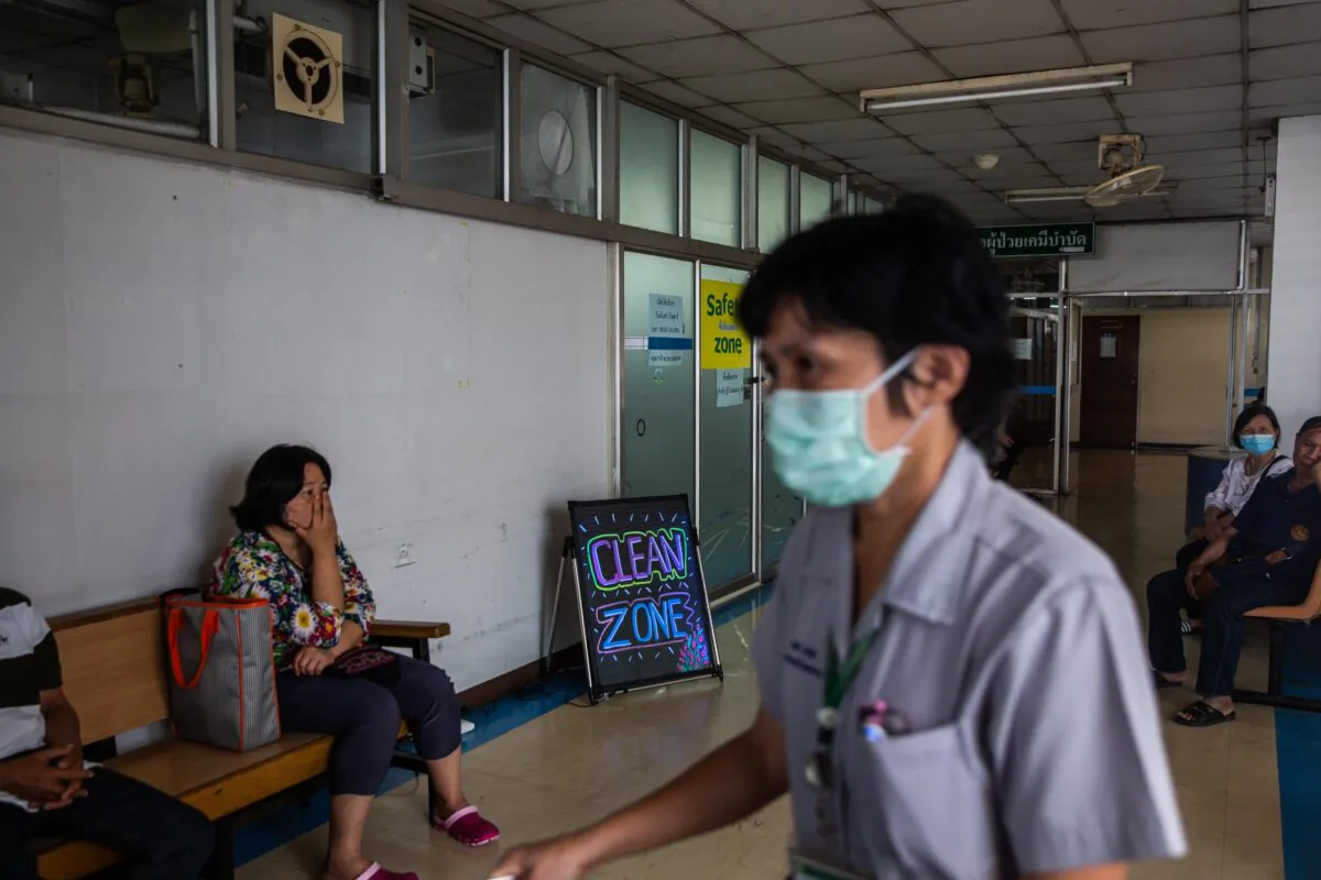 A nurse walks past a "clean zone," a room with purified air for respiratory illness patients, at the Suan Dok Hospital in Chiang Mai, Thailand on April 22, 2019. (Lauren DeCicca/Getty Images)
