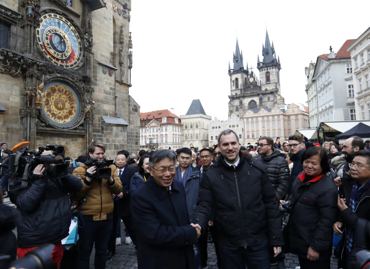 Mayor of Prague Zdenek Hrib, left, and Taipei city mayor Ko Wen-je shake hands before signing a partnership agreement between the two cities at the Old Town Square in Prague, Czech Republic, on Jan. 13, 2020. (Petr David Josek/AP)