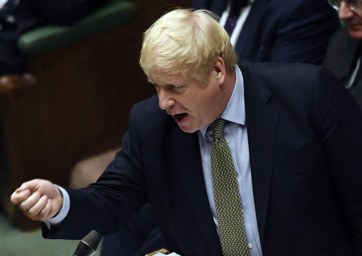 Britain's Prime Minister Boris Johnson gestures during the first Prime Minister's Questions of the year, in the House of Commons in London on Jan. 8, 2020. (Jessica Taylor/House of Commons via AP)