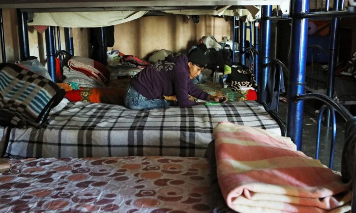 A Central American migrant remains at El Buen Samaritano shelter while waiting to apply for asylum in the United States, in Ciudad Juarez, Chihuahua state, Mexico, on Dec. 17, 2019. (Herika Martinez/AFP via Getty Images)