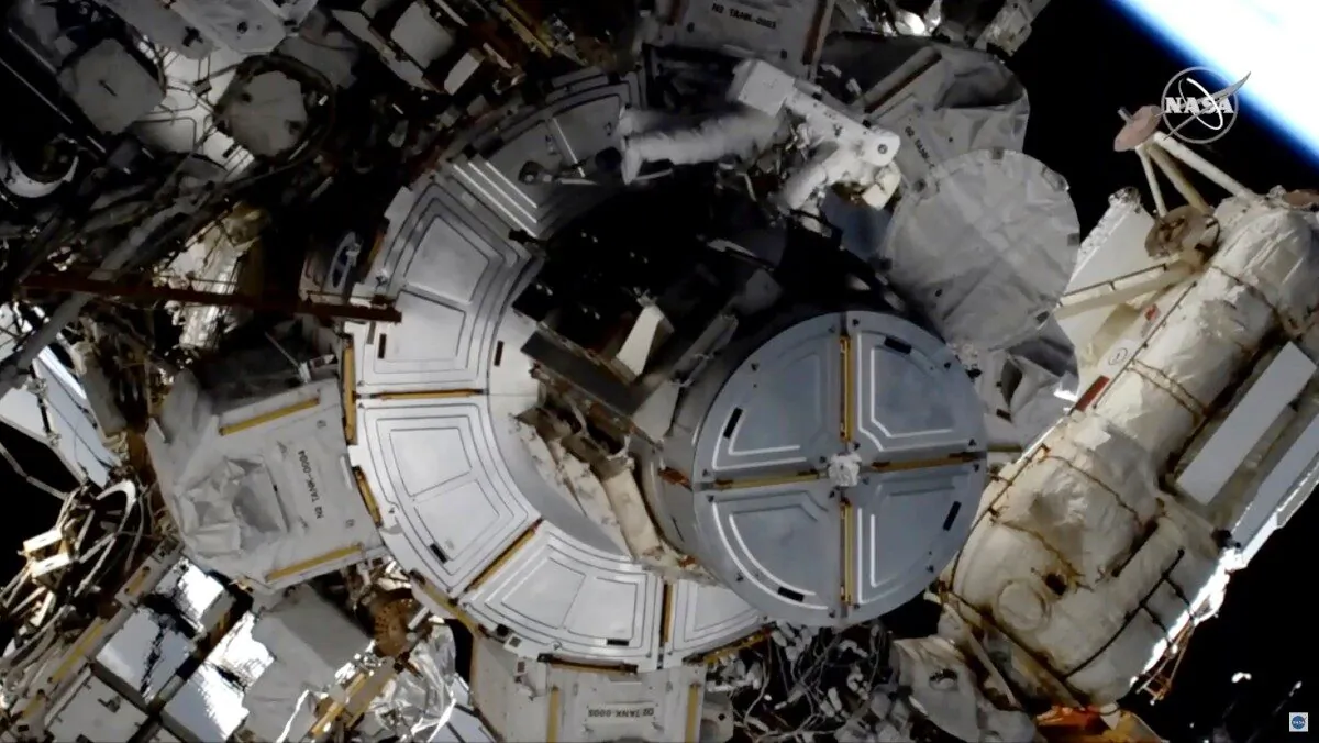 NASA astronaut Jessica Meir works to finish upgrading the International Space Station's power grid, on Jan. 15, 2020. (NASA via AP)