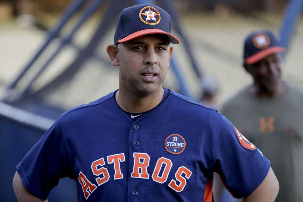 In this Oct. 23, 2017, file photo, Houston Astros bench coach Alex Cora watches batting practice during media day for baseball's World Series against the Los Angeles Dodgers, in Los Angeles. (David J. Phillip/AP)