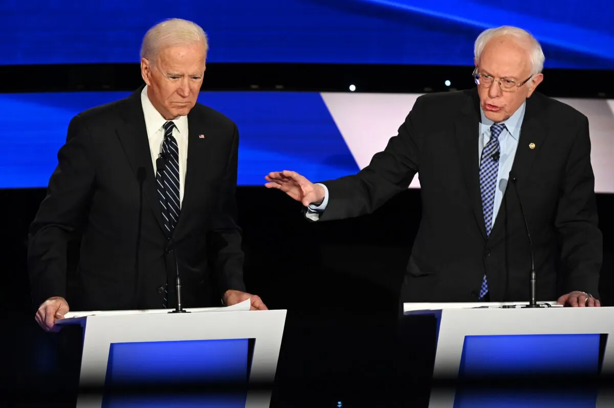 Democratic presidential hopefuls former Vice President Joe Biden (L) and Sen. Bernie Sanders (I-Vt.) participate of the seventh Democratic primary debate of the 2020 presidential campaign season at the Drake University campus in Des Moines, Iowa, on Jan. 14, 2020. (Robyn Beck/AFP via Getty Images)