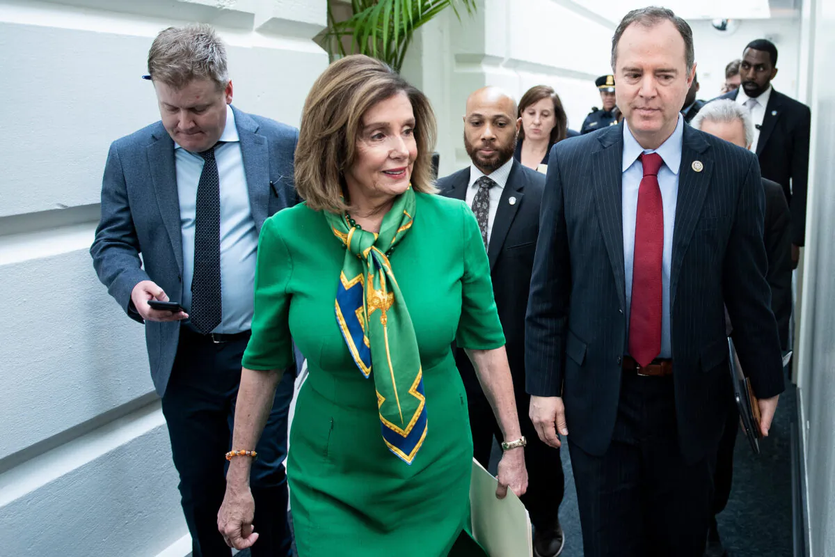 House Speaker Nancy Pelosi (D-Calif.) and House Intelligence Committee Chairman Adam Schiff (D-Calif.) leave after a caucus meeting with House Democrats on Capitol Hill in Washington on Jan. 14, 2020. (Brendan Smialowski/AFP via Getty Images)