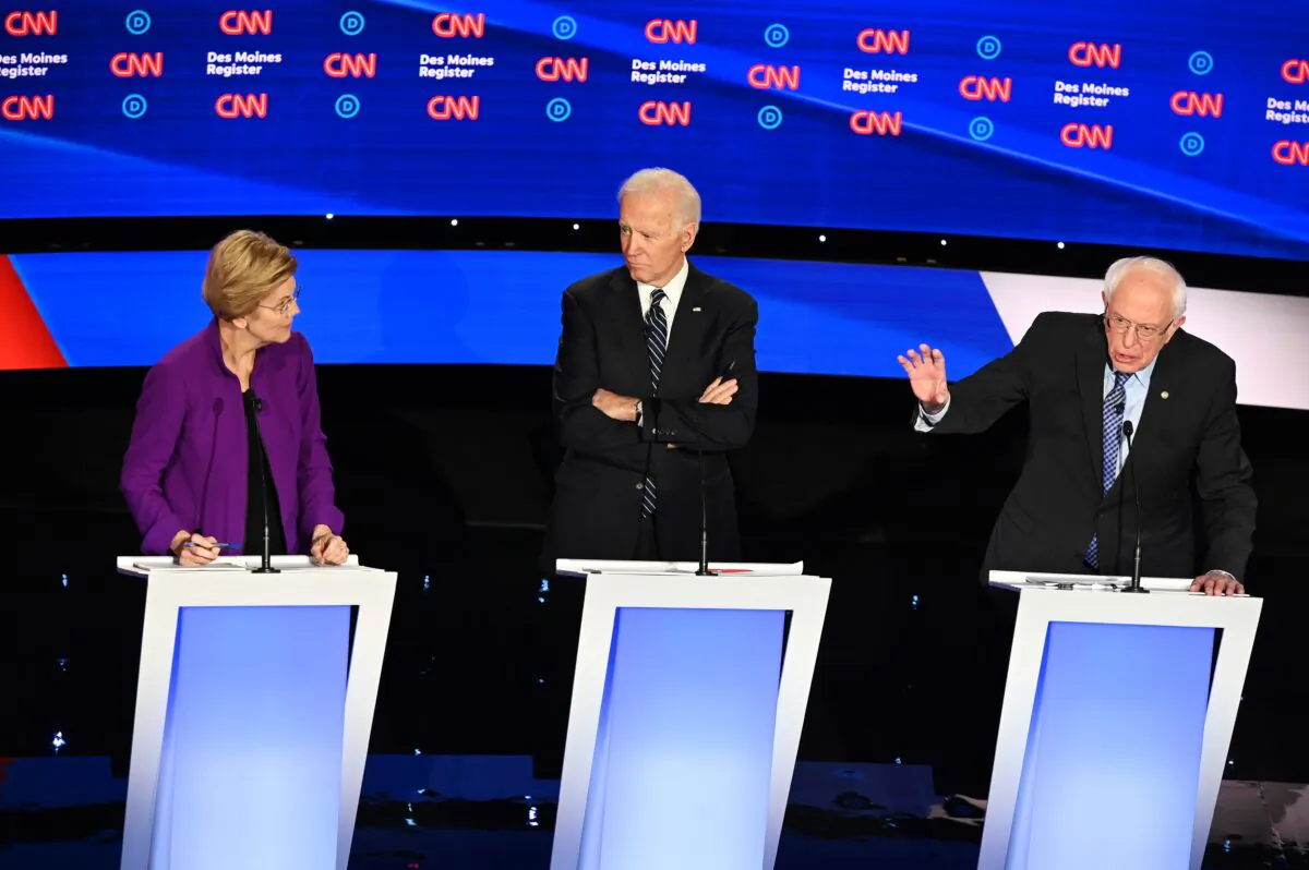 Democratic presidential hopefuls Massachusetts Senator Elizabeth Warren (D-Mass.), left, former Vice President Joe Biden,center and Sen. Bernie Sanders I-Vt.) participate of the seventh Democratic primary debate of the 2020 presidential campaign season at the Drake University campus in Des Moines, Iowa on Jan. 14, 2020. (Robyn Beck/AFP via Getty Images)