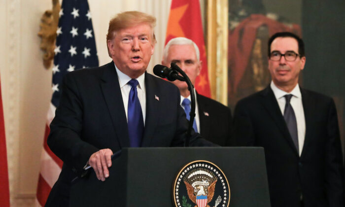 L-R: President Donald Trump, Vice President Mike Pence, Treasury Secretary Steve Mnuchin, and U.S. Trade Representative Robert Lighthizer, during the signing of phase one of a trade deal with China in the East Room of the White House in Washington on Jan. 15, 2020. (Charlotte Cuthbertson/The Epoch Times)