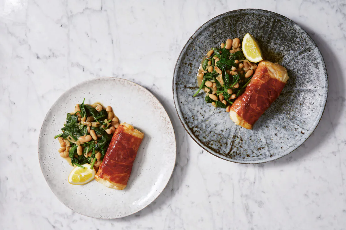 Prosciutto-wrapped cod with garlicky spinach. (Patricia Niven)