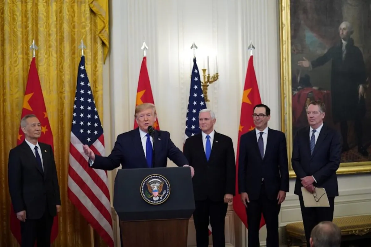 U.S. President Donald Trump stands between Chinese Vice Premier Liu He, U.S. Vice President Mike Pence, Treasury Secretary Steven Mnuchin and U.S. Trade Representative Robert Lighthizer prior to signing "phase one" of the U.S.-China trade agreement with Liu in the East Room of the White House in Washington, D.C., on Jan. 15, 2020. (Kevin Lamarque/Reuters) 