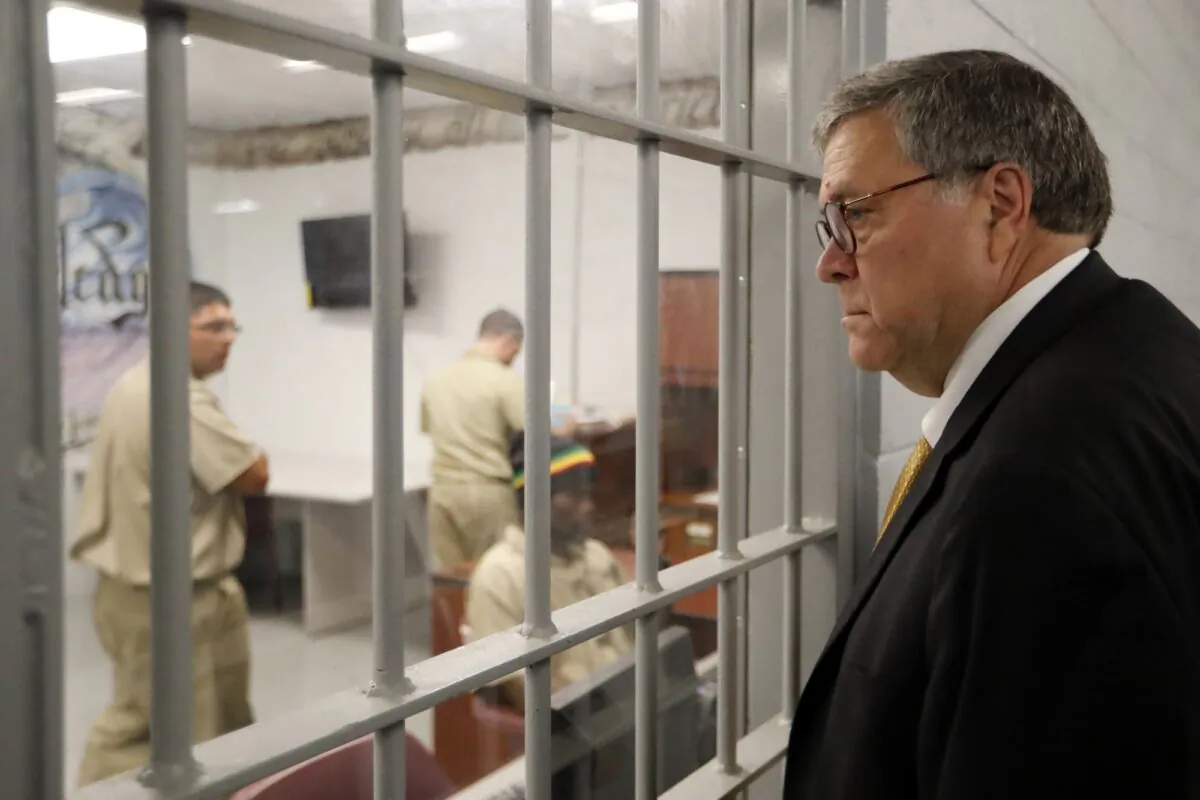 Attorney General William Barr watches as inmates work in a computer class during a tour of a federal prison in Edgefield, S.C., on July 8, 2019. (John Bazemore/AP Photo)