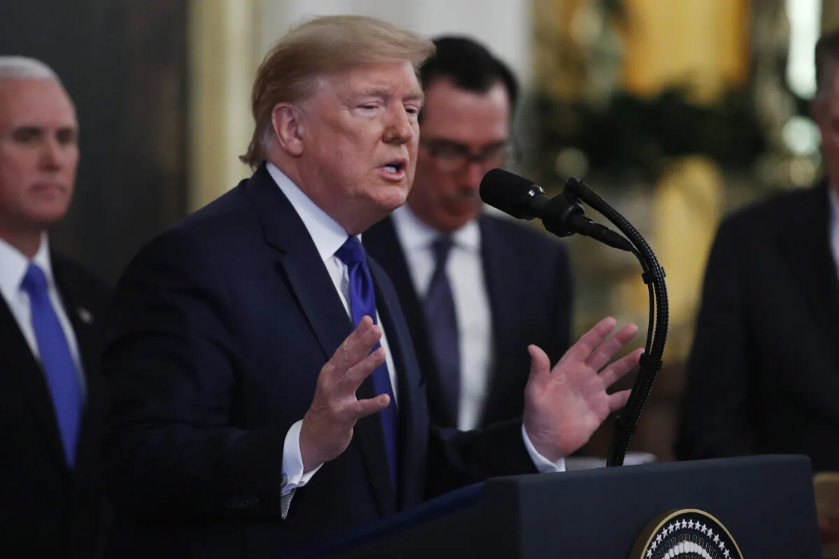 President Donald Trump gestures during a signing ceremony with Chinese Vice Premier Liu He to sign a U.S.-China trade agreement, in the East Room of the White House in Washington on Jan. 15, 2020. (Steve Helber/AP Photo)