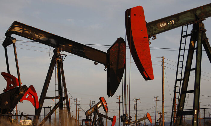 Pump jacks and wells are seen in an oil field on the Monterey Shale formation where hydraulic fracturing, or fracking, is used to extract gas and oil near McKittrick, Calif., on March 23, 2014. (David McNew/Getty Images)
