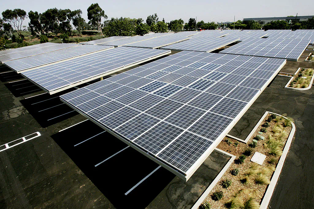 Solar panels sit above the Solar Grove parking lot at the Kyocera Plant in San Diego, Calif., on June 24, 2005. (Sandy Huffaker/Getty Images)